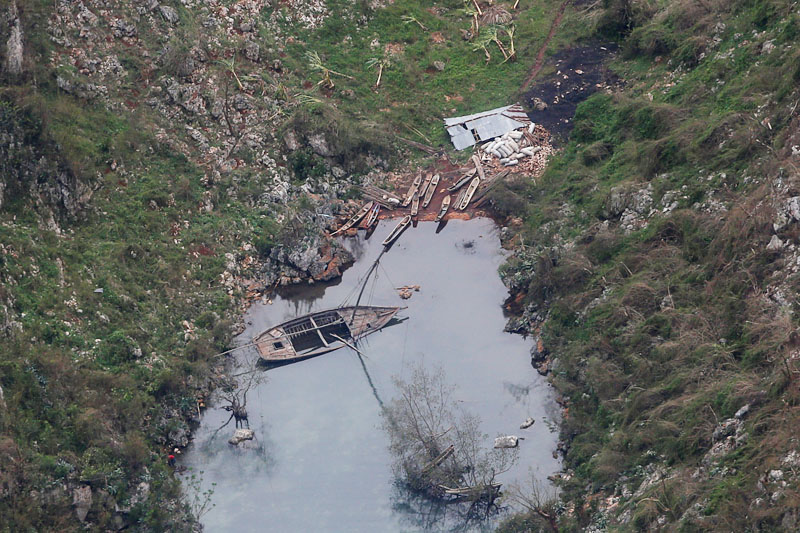 Destroyed houses and boats are seen in a village after Hurricane Matthew passes Corail, Haiti, on October 6, 2016. Photo: Reuters