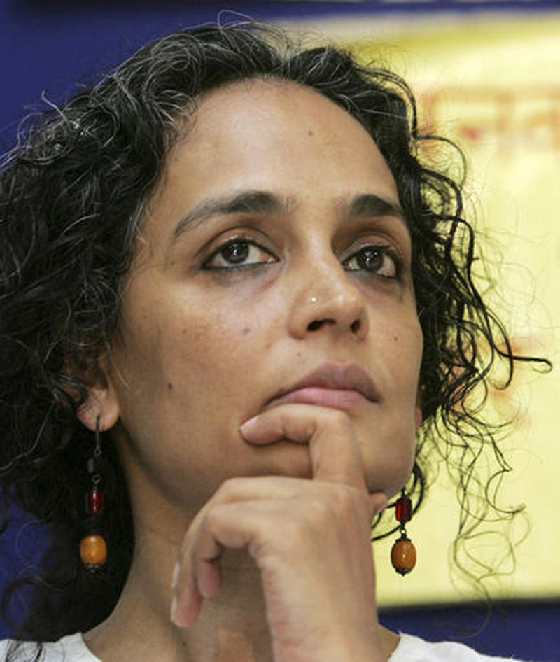 FILE u0096 In this May 17, 2006 file photo, Indian author and social activist Arundhati Roy listens to a speaker during a press conference organidsed by People's Union for Civil Liberties in New Delhi, India. Photo: AP