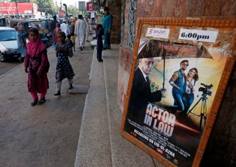 An advertising poster for an Indian film is seen outside a movie theater in Karachi, Pakistan, September 30, 2016. REUTERS/Akhtar Soomro