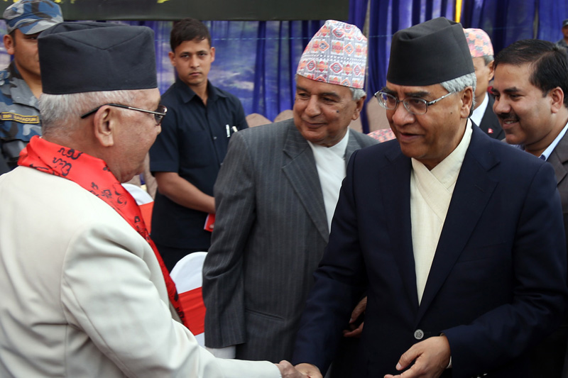 CPN-UML Chairman KP Sharma Oli (left) welcomes Nepali Congress President Sher Bahadur Deuba (right) and senior leader Ram Chandra Paudel to a tea party hosted by the UML on the occasion of Dashain, Tihar, Nepal Samvat New Year and Chhath festivals, in Kathmandu, on Saturday, October 15, 2016. Photo: RSS