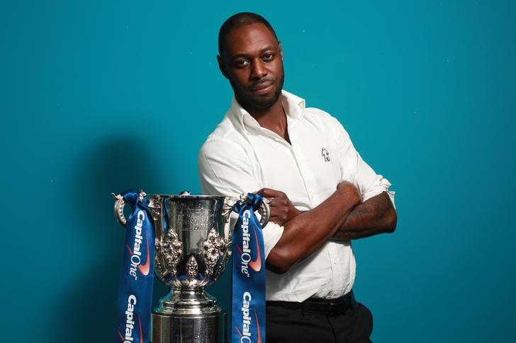 Football - David Seaman and Ledley King with The Capital One Cup - Great Portland Street - 21/9/15nLedley King poses with the Capital One CupnMandatory Credit: Action Images / John MarshnLivepic