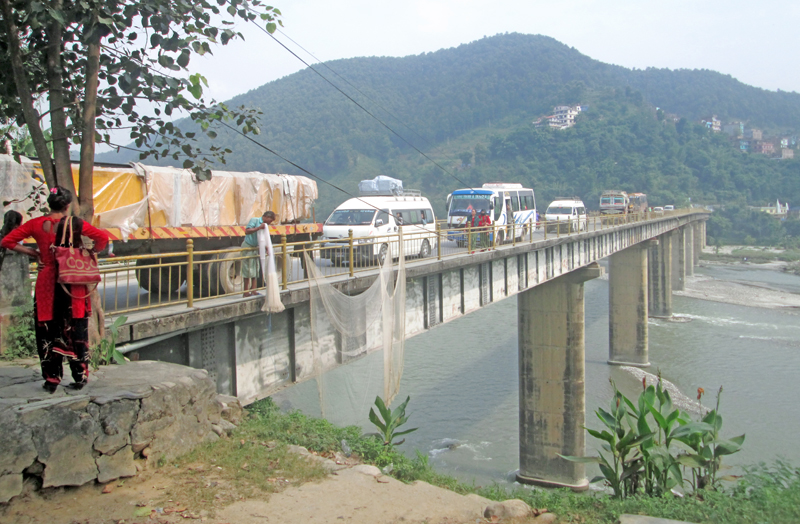 Vehicles crossing a bridge over the Madi River, in Damauli, Tanahun, on Monday, October 24, 2016. Photo: THT