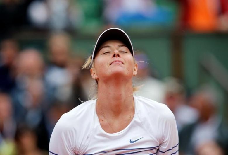 FILE PHOTO -  Maria Sharapova of Russia celebrates after beating Samantha Stosur of Australia during their women's singles match at the French Open tennis tournament at the Roland Garros stadium in Paris, France, May 29, 2015.             REUTERS/Jean-Paul Pelissier/File Photo