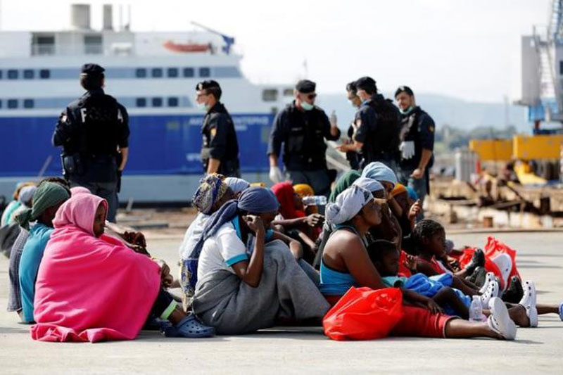 Migrants rests after disembarking from Dignity ship in the Sicilian harbour of Augusta, Italy, on October 19, 2016. Photo: Reuters