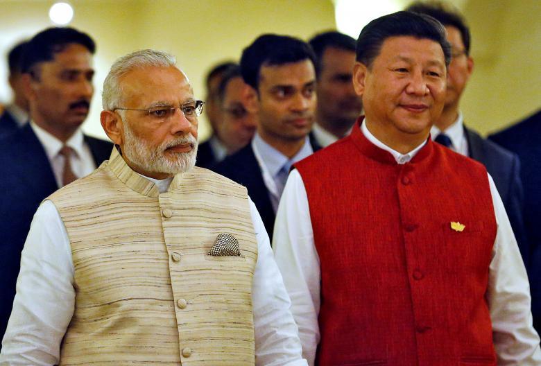 Indian Prime Minister Narendra Modi (L) and Chinese President Xi Jinping  arrive for a photo opportunity ahead of BRICS (Brazil, Russia, India, China and South Africa) Summit in Benaulim, in Goa, India, October 15, 2016. REUTERS/Danish Siddiqui