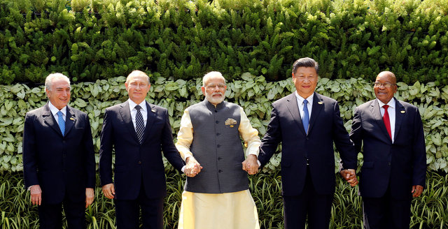 (L-R) Brazil's President Michel Temer, Russian President Vladimir Putin, Indian Prime Minister Narendra Modi, Chinese President Xi Jinping and South African President Jacob Zuma pose for a group picture during BRICS (Brazil, Russia, India, China and South Africa) Summit in Benaulim, in the western state of Goa, India, October 16, 2016. REUTERS