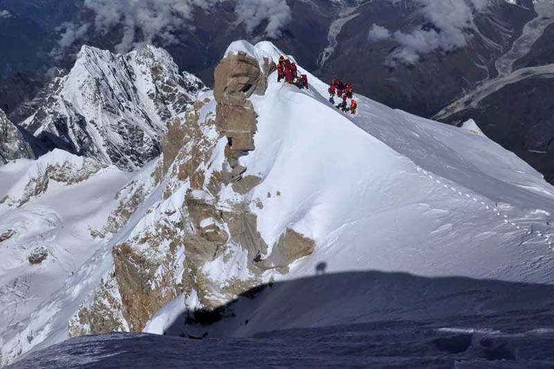 Climbers inch closer to the summit of Mt Mansalu. Photo Courtesy: Mingma Sherpa