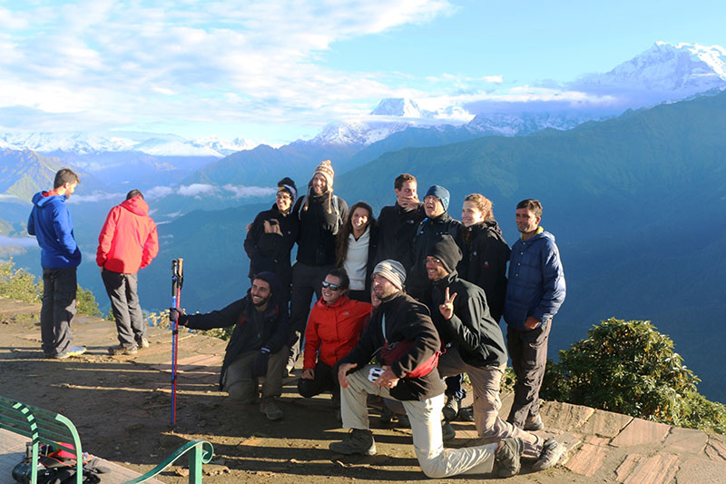 Nilgiri Himal and Annapurna mountain range are seen in the background as trekkers pose for photograph at Poonhill in Myagdi district, on Friday, October 21, 2016. photo: RSS