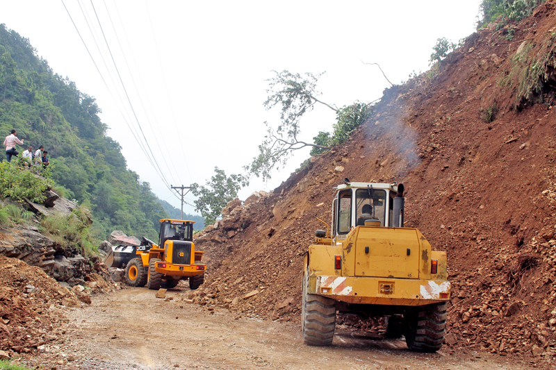 Bulldozers being used to clear the landslide debris at Ainapahara in Tanahun district along the Anbukhairini-Muglin road section of Prithvi Highway, on Wednesday, October 5, 2016. Photo: RSS