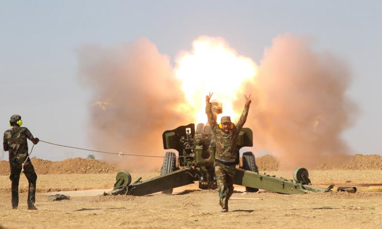 Popular Mobilization Forces (PMF) personnel fire artillery during clashes with Islamic State militants south of Mosul October 29, 2016. REUTERS/Stringer