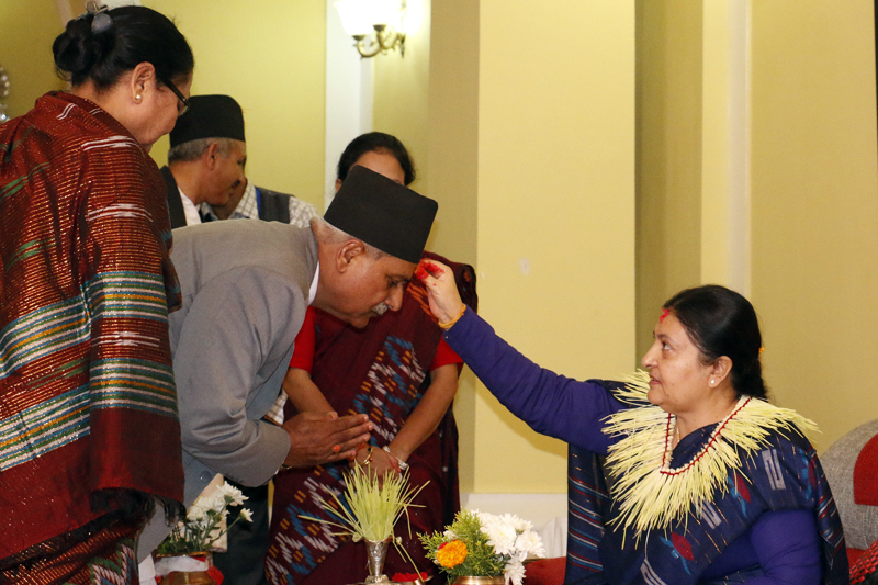 President Bidya Devi Bhandari offers Dashain Tika to her kin, at the Sheetal Niwas, on Tuesday, October 11, 2016. Photo: RSS