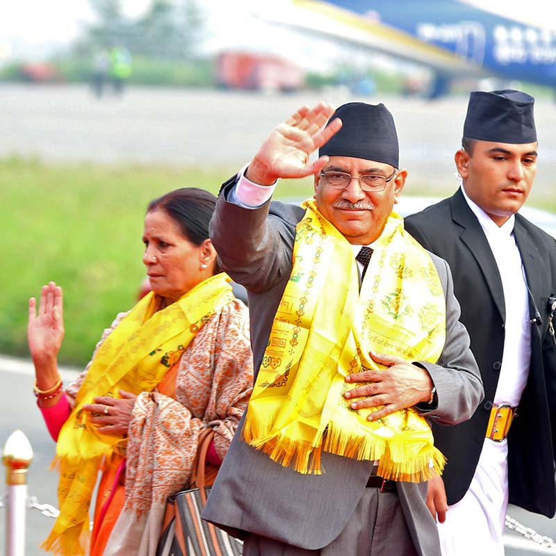 Prime Minister Pushpa Kamal Dahal waves before he leaves for India to participate in the BRICS-BIMSTEC Outreach Summit at the Tribhuvan International Airport in Kathmandu, on Saturday, October 15, 2016. Photo: RSS