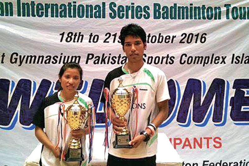Ratnajit Tamang and his sister Nangsal pose after winning the mixed doubles title of the Yonex-Sunrise Pakistan International Series Badminton Tournament in Islamabad on Friday, October 21, 2016. Photo: THT