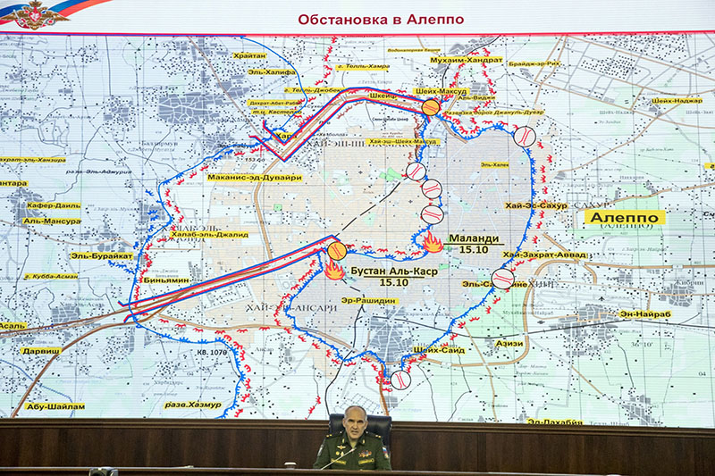 Lieutenant General Sergei Rudskoi of the Russian military's General Staff speaks to the media, with a map of the area around Aleppo seen in the background, at the Russian Defense Ministry's headquarters in Moscow, Russia, on Monday, October 17, 2016. Photo: AP