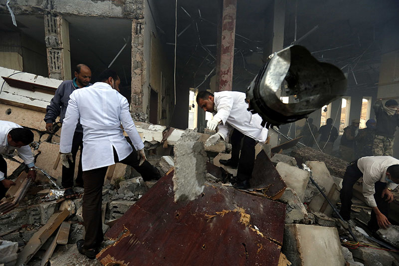 Medics search for bodies under the rubble of a funeral hall that was targeted by a Saudi-led coalition airstrike in Sanaa, Yemen, on Saturday, October 8, 2016. Photo: AP
