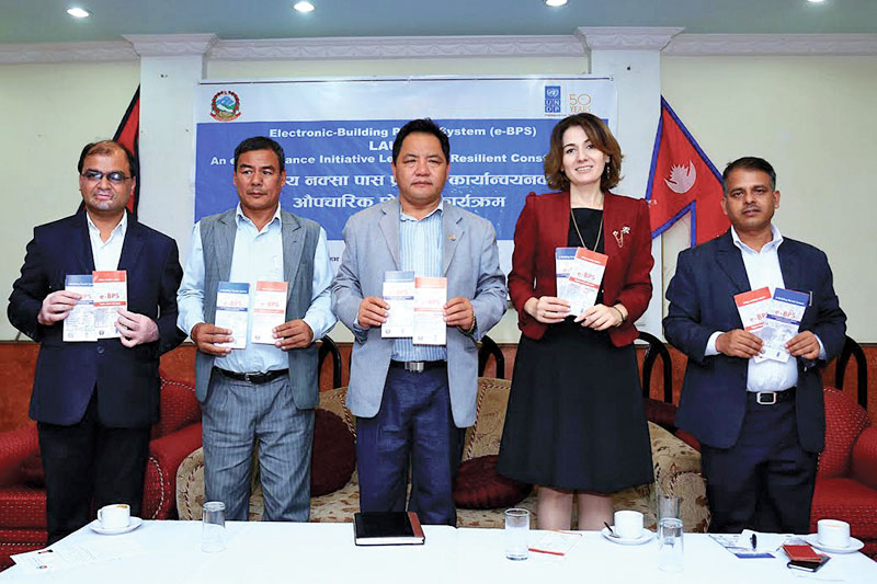 State Minister for Federal Affairs and Local Development Shree Prasad Jabegu (centre) and UNDP Deputy Country Director Sophie Kemkhadze during a programme in Kirtipur, on Tuesday, October 4, 2016. Photo: THT