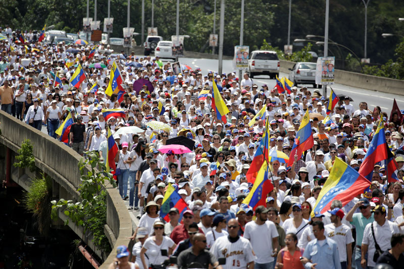Opposition supporters take part in a rally to demand a referendum to remove Venezuela's President Nicolas Maduro in Caracas, Venezuela, on October 22, 2016. Photo: Reuters
