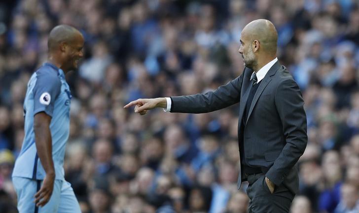 Britain Soccer Football - Manchester City v Southampton - Premier League - Etihad Stadium - 23/10/16nManchester City's Vincent Kompany walks past manager Pep Guardiola as he is substituted nReuters / Phil NoblenLivepic