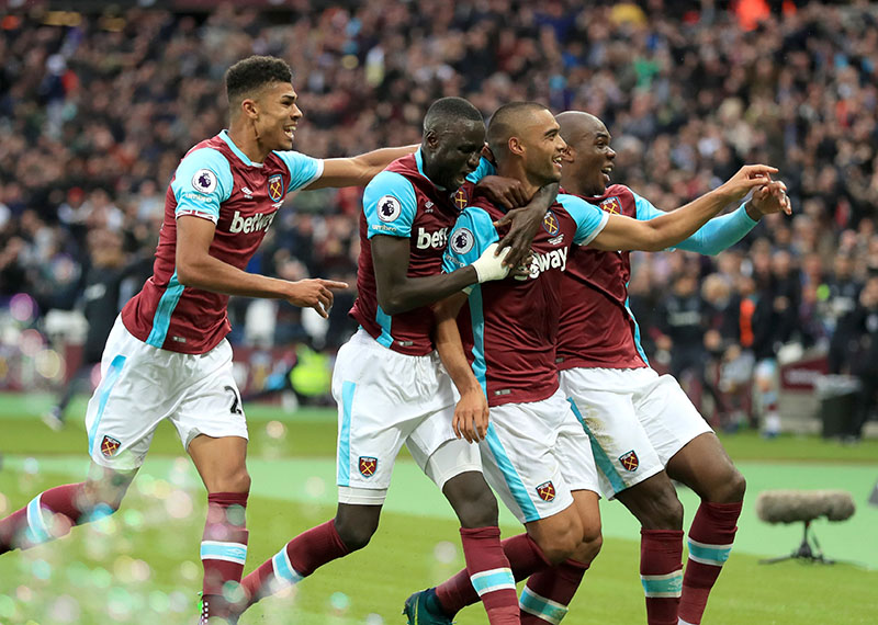 West Ham United's Winston Reid (second-right) celebrates with team mates after scoring his team's first goal against Sunderland during the English Premier League soccer match at the London Stadium, London, on Saturday, October 22, 2016. Photo: Adam Davy/PA via AP