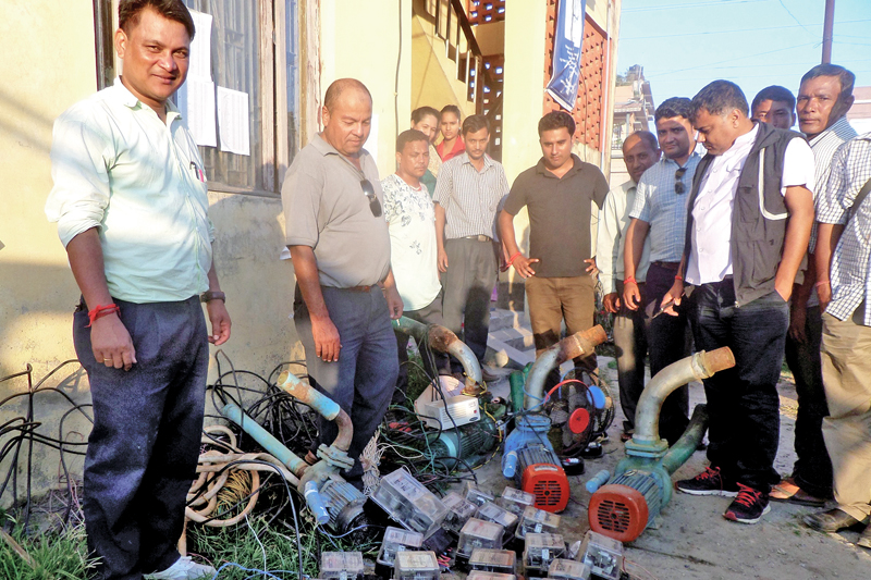 Staffers of Antarmani  Distribution Centre of Nepal Electricity Authority displaying nequipment used by locals for stealing electricity, in Jhapa, on Friday, October 28, 2016. Photo: RSS