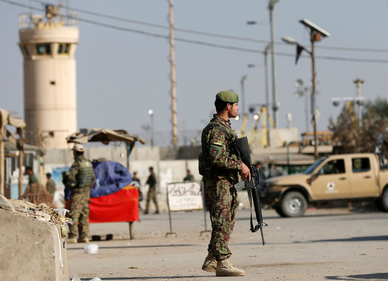 Afghan National Army (ANA) soldiers keep watch outside the Bagram Airfield entrance gate, after an explosion at the NATO air base, north of Kabul, Afghanistan, on November 12, 2016. Photo: Reuters