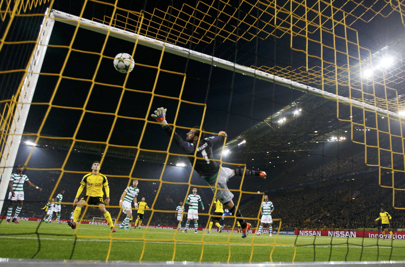 Borussia Dortmund's Adrian Ramos scores a goal past Sporting Lisbon's goalkeeper Rui Patricio. Photo: Reuters