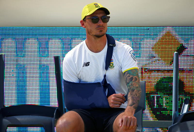 Injured South African bowler Dale Steyn sits on the boundary before the start of play at the WACA Ground in Perth. Photo: Reuters