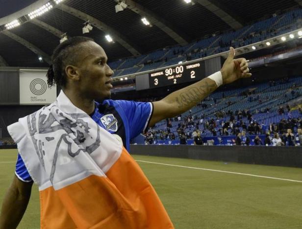 Nov 22, 2016; Montreal, Quebec, CAN; Montreal Impact forward Didier Drogba (11) interacts with fans after the first leg game against the Toronto FC of the MLS Eastern Conference Championship at Olympic Stadium. Mandatory Credit: Eric Bolte-USA TODAY Sports