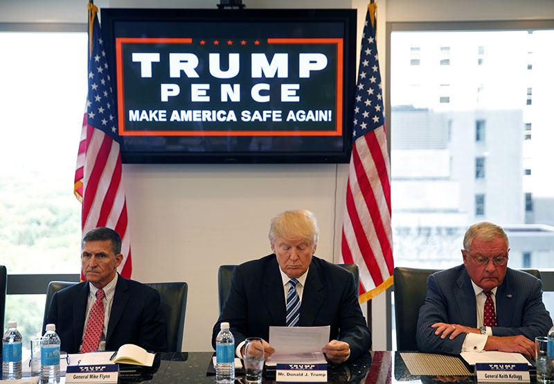 FILE - Then-Republican presidential candidate Donald Trump participates in a roundtable discussion on national security in his offices in Trump Tower in New York, with Retired Army General Mike Flynn (left) Retired Army Lieutenant General Keith Kellogg, on August 17, 2016. Photo: AP
