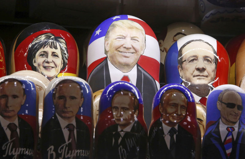 Painted Matryoshka dolls, or Russian nesting dolls, bearing the faces of US Republican presidential nominee Donald Trump, German Chancellor Angela Merkel, French President Francois Hollande and Russian President Vladimir Putin are displayed for sale at a souvenir shop in central Moscow, Russia, on November 7, 2016. Photo: Reuters