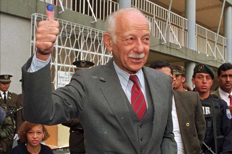 File- In this May 19, 1996 file photo, Ecuadorean President Sixto Duran-Ballen shows his finger stained with ink after voting in Quito, Ecuador. Photo: AP