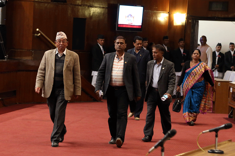 Federal Socialist Forum-Nepal (FSF-N) leader Ashok Rai (left) along with other lawmakers walk out of the Parliament on Friday, November 11, 2016, demanding the amendment of Constitution as per the agreement between the Federal Alliance and the ruling alliance of Nepali Congress-CPN Maoist Centre. Photo: RSS 