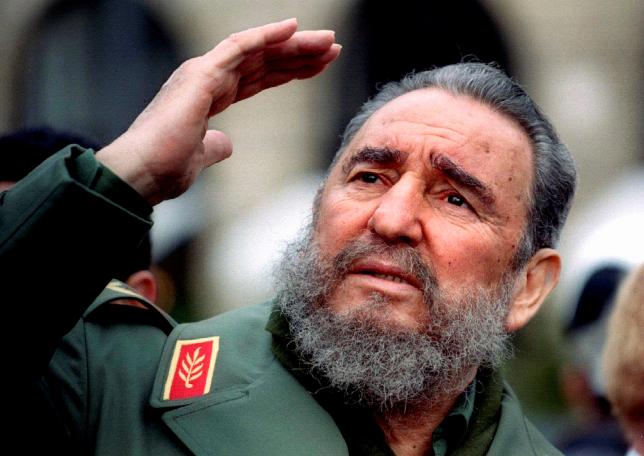 Cuba's President Fidel Castro gestures during a tour of Paris in this March 15, 1995 file photo.   REUTERS/Charles Platiau/Files