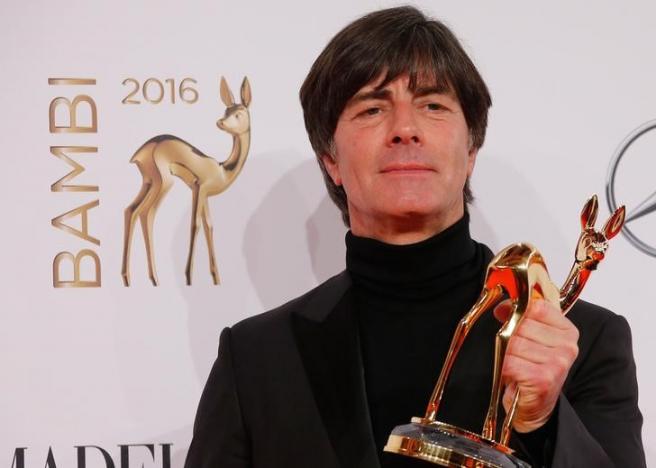German national soccer coach Joachim Loew poses with the Integration award during the Bambi 2016 media awards ceremony in Berlin, Germany, November 17, 2016.      REUTERS/Fabrizio Bensch