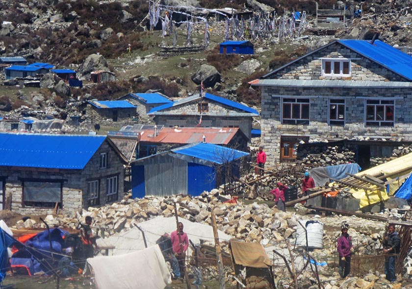 People are seen working to rebuild houses in Kyanjin Gumba in Langtang region of Rasuwa district in Nepal on April 25, 2016, one year after the devastating earthquake. Photo: Keshav P. Koirala