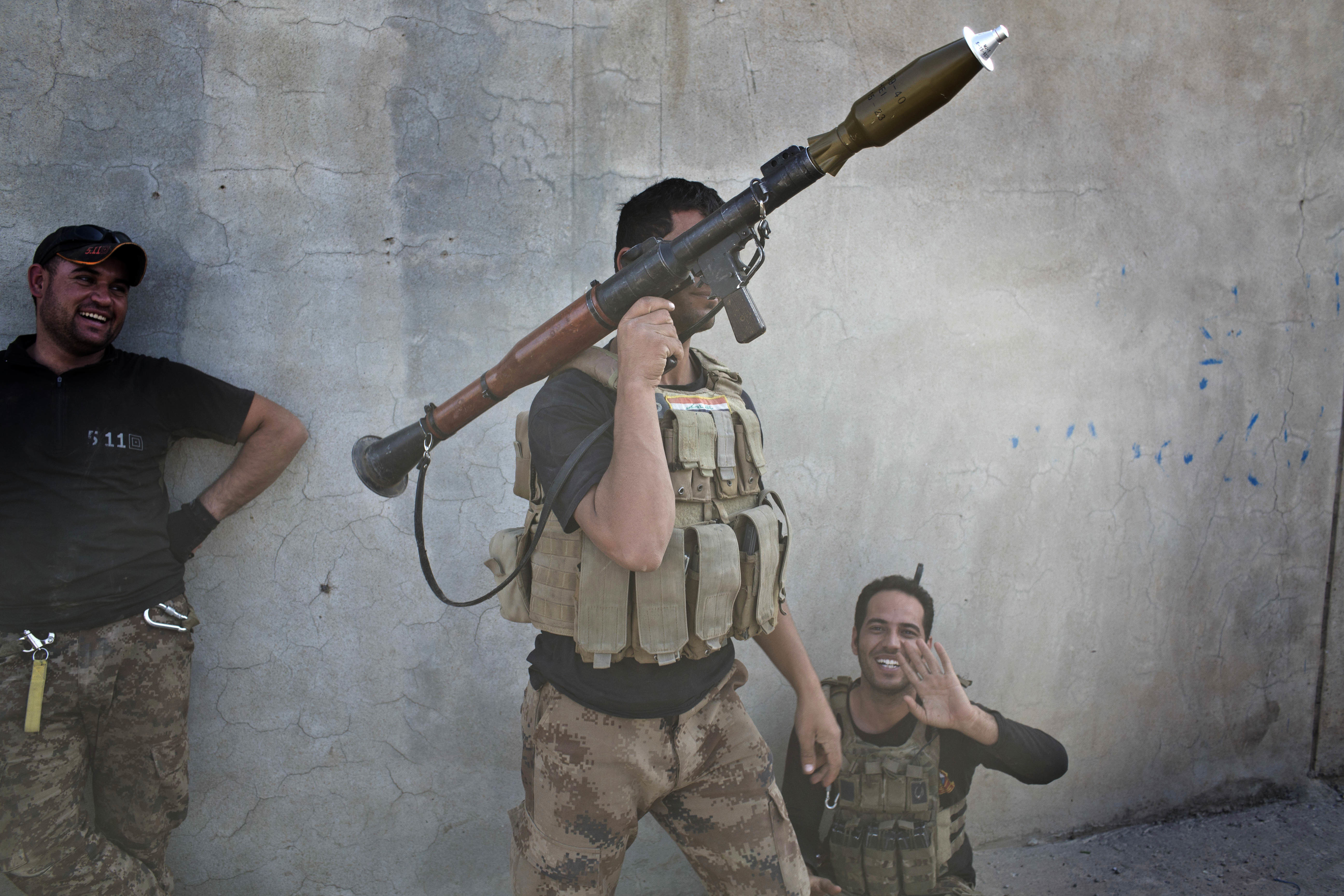 An Iraqi special forces soldier holds a rocket propelled grenade launcher in Bazwaya, some 8 kilometers from the center of Mosul, Iraq, Monday, Oct. 31, 2016. Iraqi special forces stood poised to enter Mosul in an offensive to drive out Islamic State militants after sweeping into the last village on the city's eastern edge Monday while fending off suicide car bombs without losing a soldier. (AP Photo/Marko Drobnjakovic)