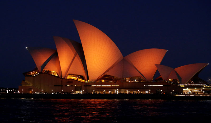 The Sydney Opera House is lit in orange to honour the visit of King Willem-Alexander and Queen Maxima of the Netherlands to Australia on Wednesday, November 2, 2016. Photo: REUTERS