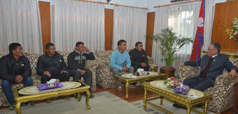 The rescued Nepali migrant workers meeting Prime Minister Pushpa Kamal Dahal. Photo: PM's Secretariat