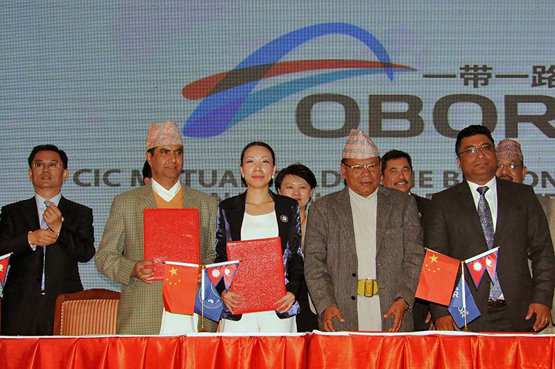 Officials from Nepal and China show the signed cooperation agreements with the 'One Belt One Road' International Trade Platform, during a function held in Kathmandu, on Saturday, November 19, 2016. Photo: THT