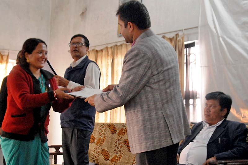 Project for Agriculture Commercialisation and Trade (PACT) Director Govinda Prasad Sharma provides a grant agreement paper in Biratnagar, on Tuesday, November 22, 2016. Photo Courtesy: PACT