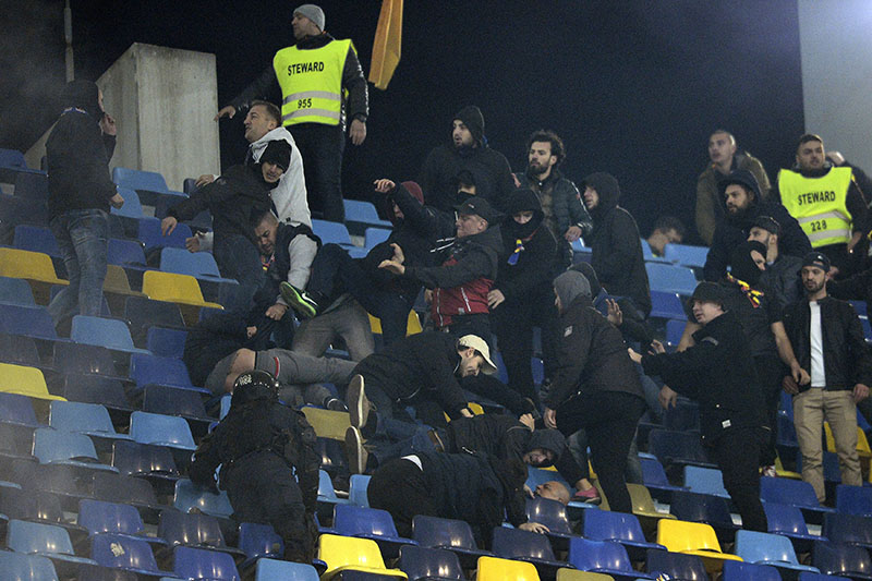 Supporters clash during the World Cup Group E, qualifying soccer match between Romania and Poland on the National Arena stadium, in Bucharest, Romania, on Friday, November 11, 2016. Photo: AP