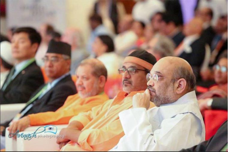 MORPHED? nThis photograph which was first posted by Avinash Photograph and shared by India Ideas Conclave on Facebook shows Lobsang Sangay (left) and Sher Bahadur Deuba (second from left) sitting together in the audience. The photograph, however, has been either hidden or removed from the timeline now.