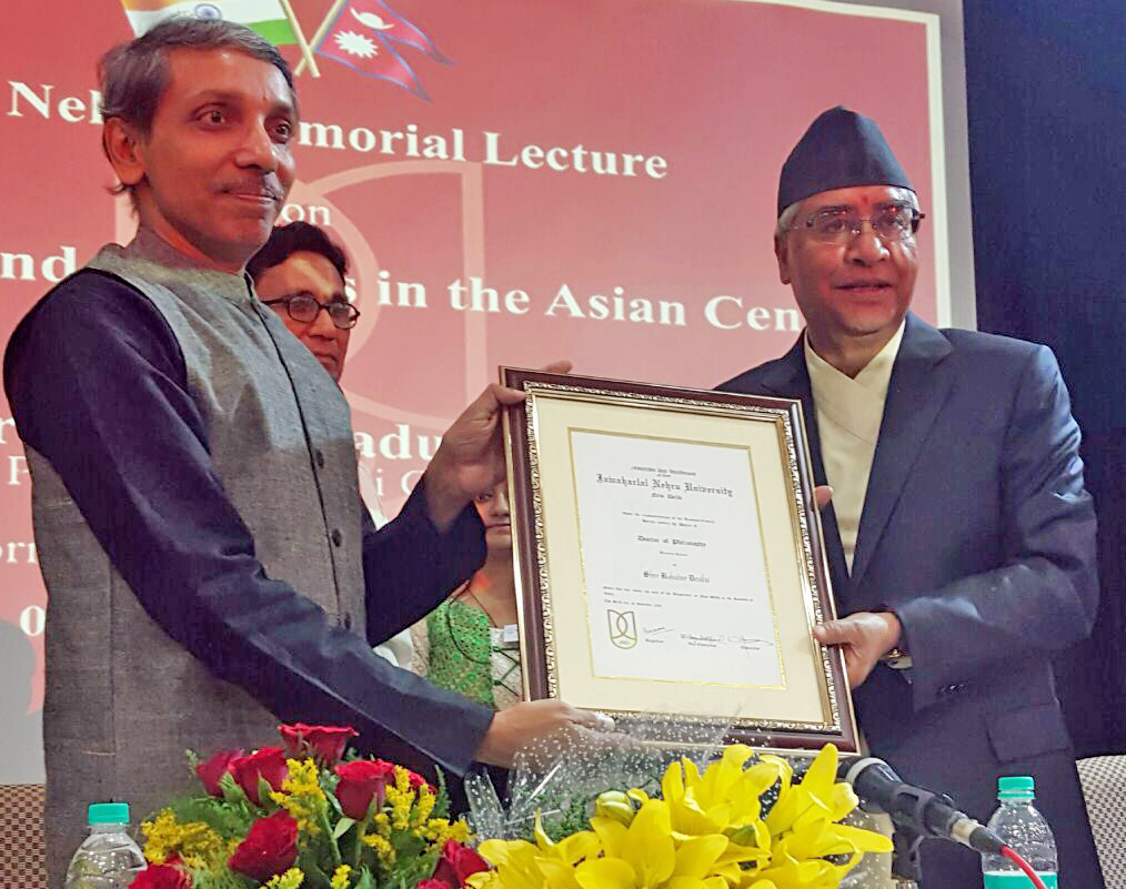 The Jawaharlal Nehru University Vice-Chancellor Jagadesh Kumar confers the Honorary Doctorate on Nepali Congress President Sher Bahadur Deuba, in New Delhi of India, on Sunday, November 6, 2016. Photo: NC Central Office