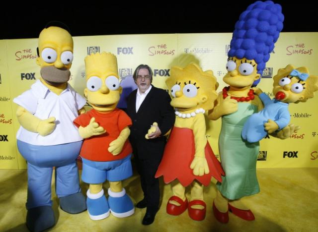 Matt Groening (C), creator of The Simpsons, poses with characters from the show (L-R) Homer, Bart, Lisa, Marge and Maggie at the 20th anniversary party for the television series at Barker hangar in Santa Monica, California October 18, 2009.    REUTERS/Mario Anzuoni