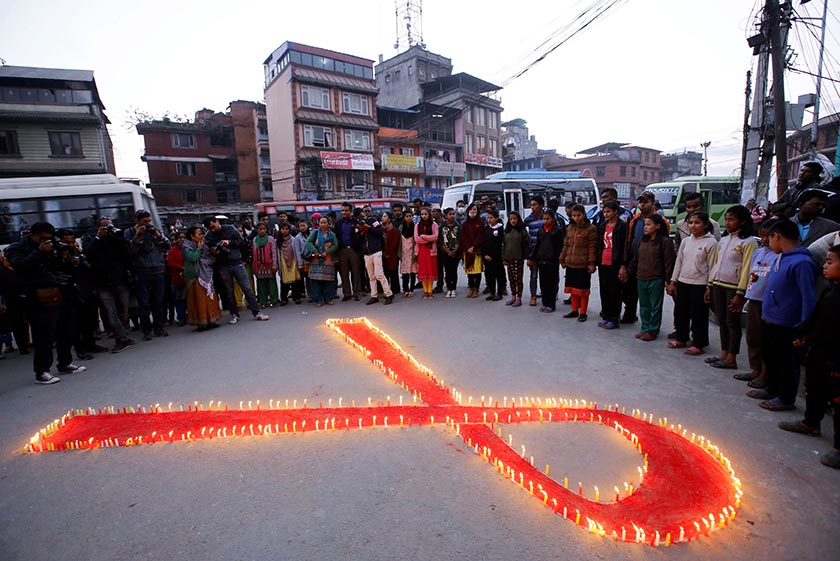 People gather during a HIV/AIDS awareness campaign ahead of World Aids Day, in Kathmandu. Photo: Reuters