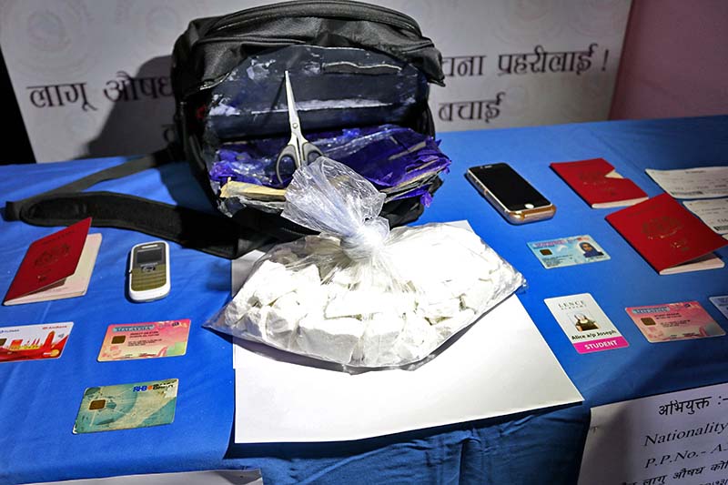 Cocaine and passports consficated from two Malaysian nationals from Thamel of Kathmandu, on Tuesday, November 29, 2016. Photo Courtesy: NCB