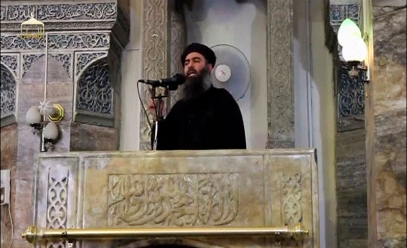 File - A man purported to be the reclusive leader of the militant Islamic State Abu Bakr al-Baghdadi marks what would have been his first public appearance, at a mosque in the centre of Mosul, according to a video recording posted on the Internet on July 5, 2014, in this still image taken from video. Photo: Reuters