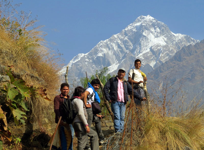 Domestic tourists trek along the trail destined for Annapurna Base Camp I, in Narchyang VDC of Myagdi district on Saturday, December 24, 2016. Photo: RSS
