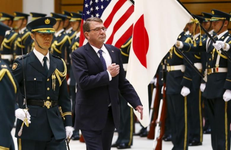 File - US Secretary of Defense Ash Carter (2nd left) inspects the honour guard before a meeting with Japan's Defense Minister Gen Nakatani (not pictured) at the defense ministry in Tokyo, on April 8, 2015. Photo: Reuters