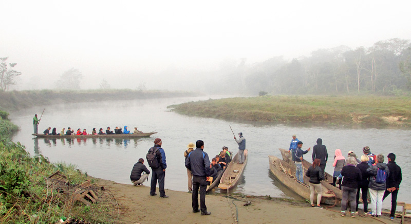 Tourists enjoying boat ride in Budhi Rapti River, Chitwan, on Thursday, December 1, 2016. Photo: THT